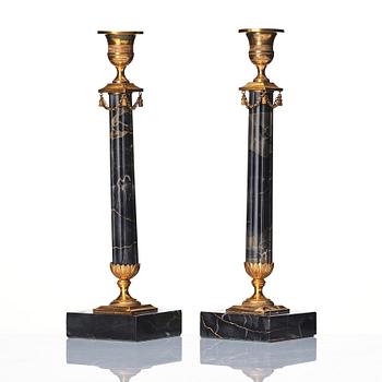 A pair of late Gustavian Portor marble candlesticks, late 18th century.