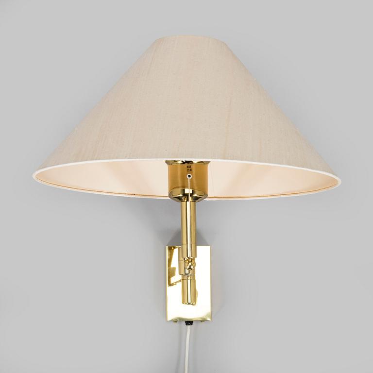 A 1970s/80s brass floor lamp, wall lamp and table lamp.