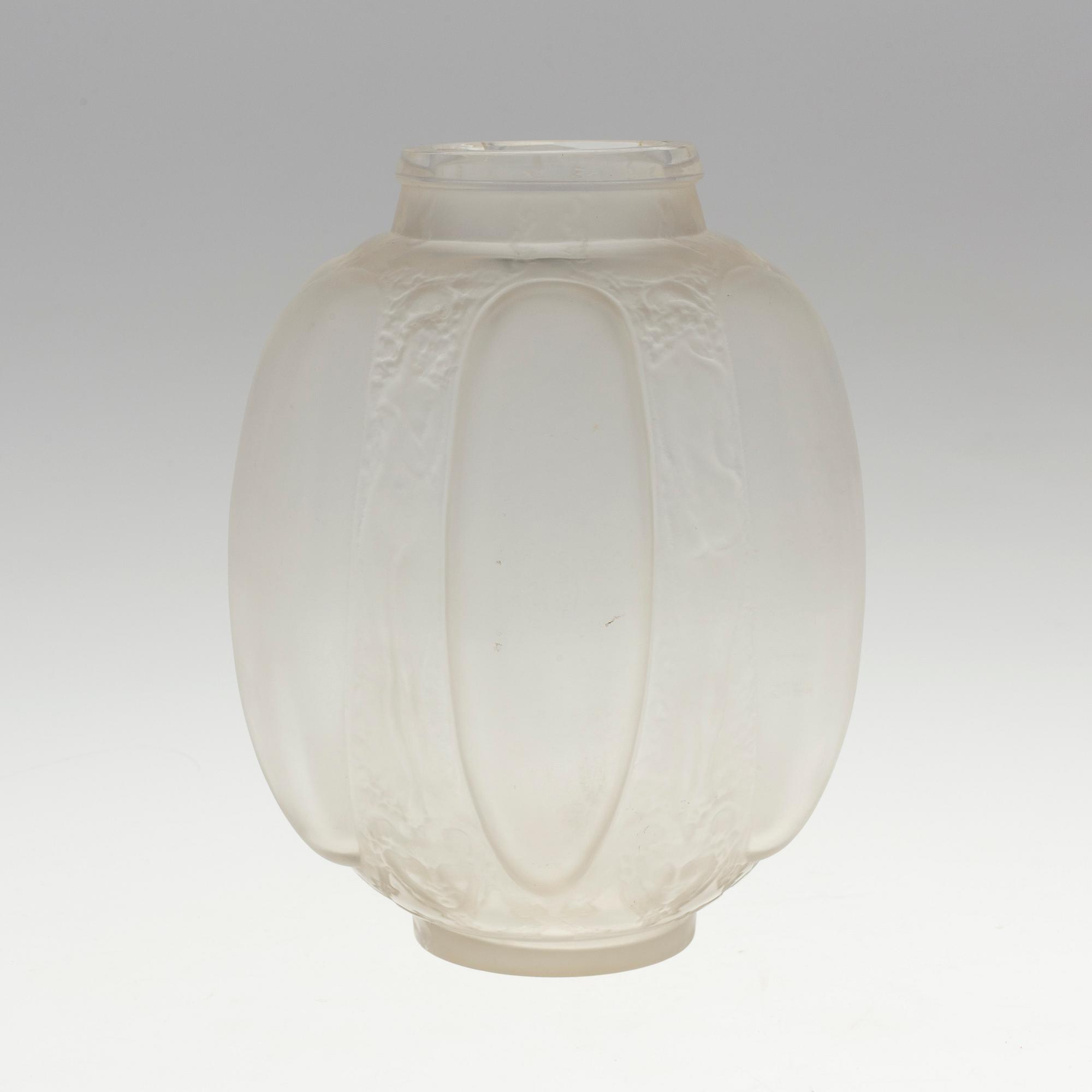 A René Lalique 'Six figurines et masques' moulded glass vase, France 1920-30's.