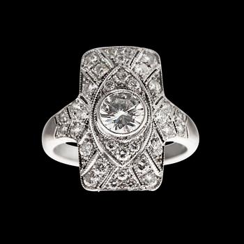 403. SORMUS, 9K valkokultaa, briljanttihiottuja timantteja n. 1.00 ct. Keskikivi n. 0.45 ct. Koko 16-. Paino 3 g.