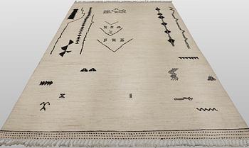 A Moroccan design carpet, c. 306 x 201 cm.