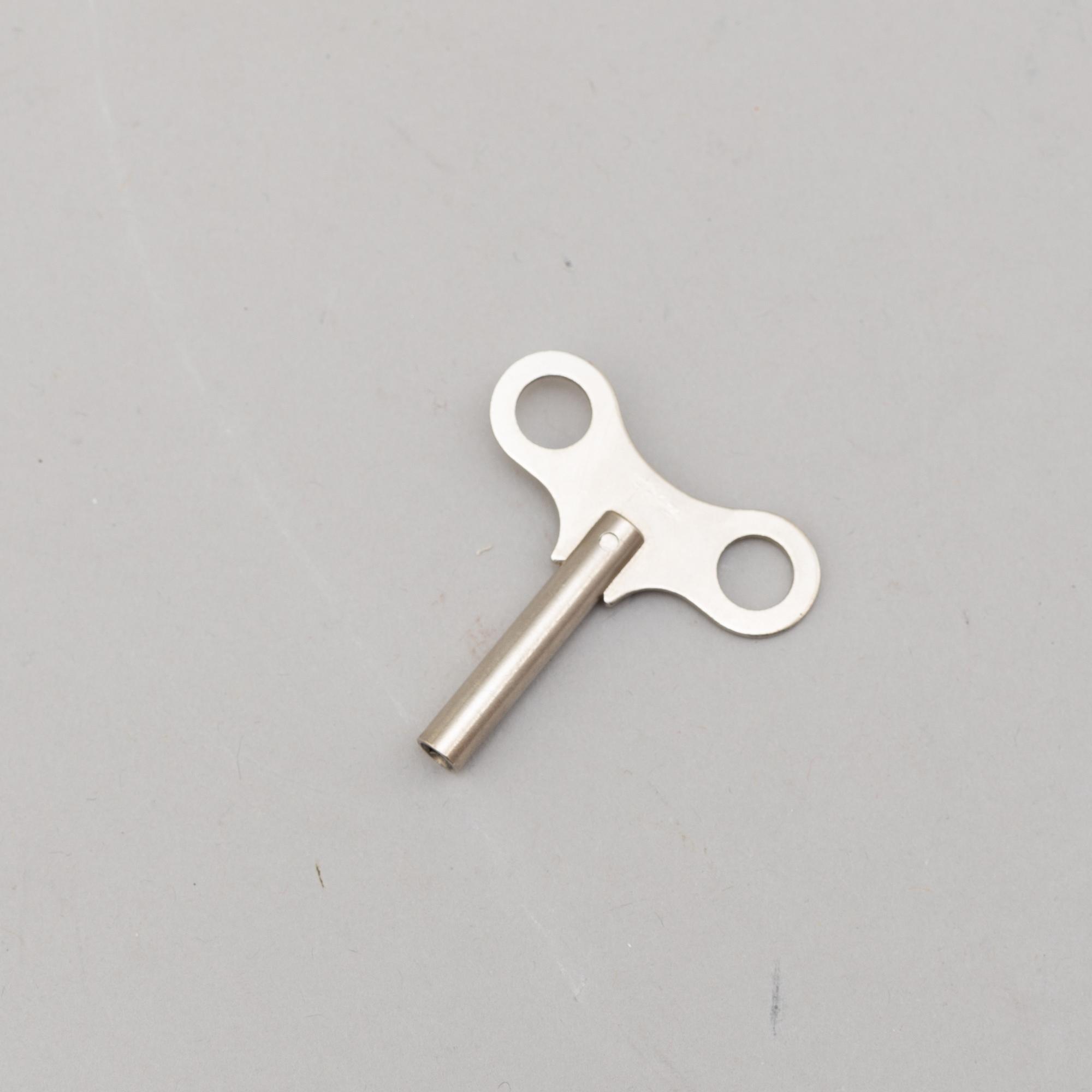 A BRASS MARINE CLOCK AND BAROMETER BY STOCKBURGER.