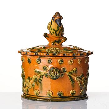 A glazed earthenware jar with cover, probably France, 19th century.