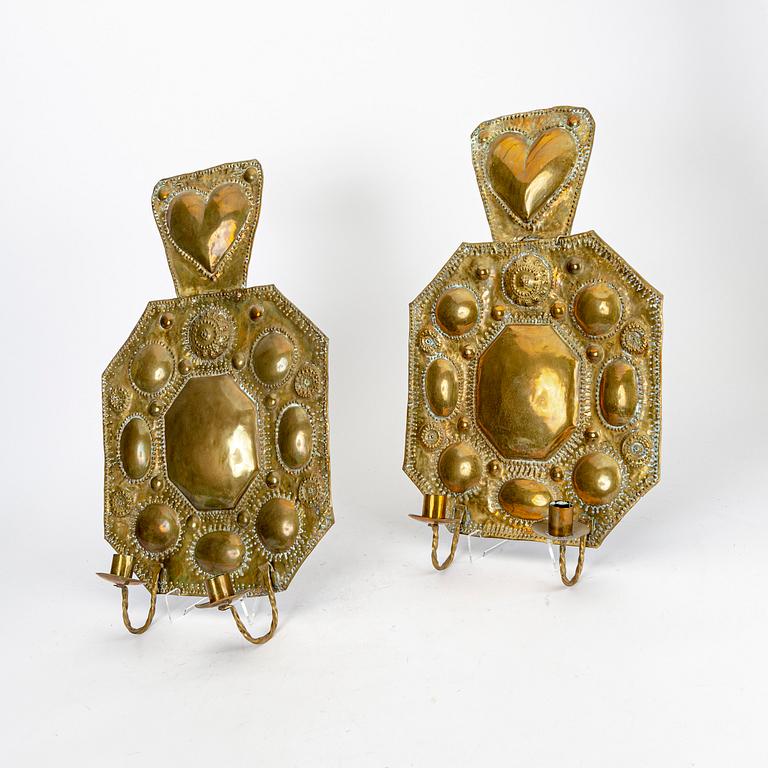 A parr of Baroque style brass wall sconces.