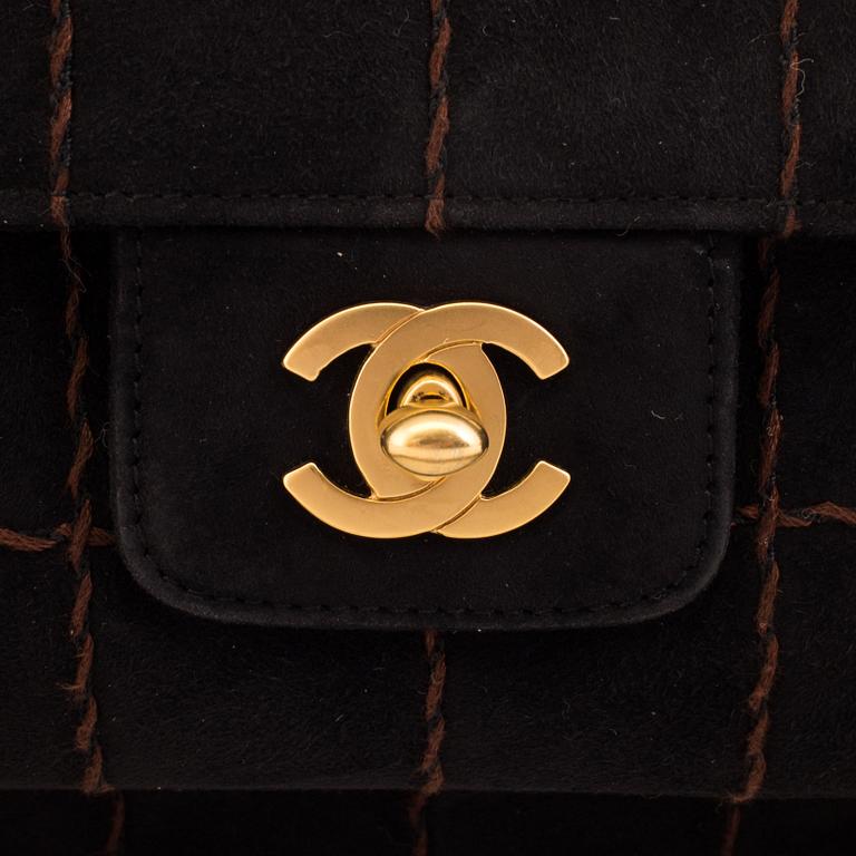 A CHOCO BAR SUEDE FLAP BAG BY CHANEL.