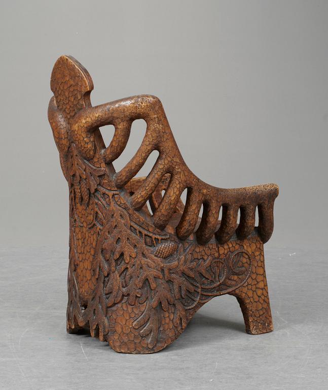 A Gustaf Fjaestad art noveau sculptured pine armchair, Sweden 1894.