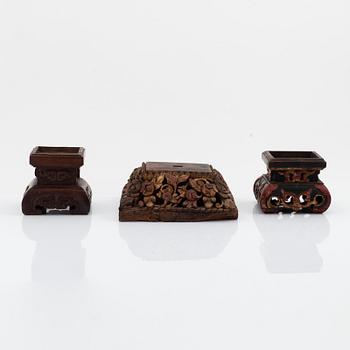 A set of three carved wooden stands, early 20th Century.
