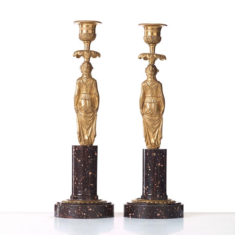 A pair of late Gustavian circa 1800 porphyry and bronze candlesticks.