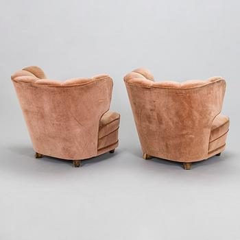 A pair of mid 20th century armchairs.