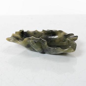 A Chinese green stone brush washer, a carved bone and a soapstone figure, partly Qing dynasty.