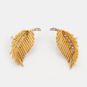 457. A pair of 18K gold earrings set with eight-cut diamonds.