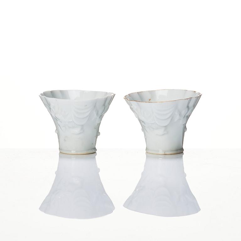 A pair of blanc de chine libation cups, Qing dynasty, 19th Century.
