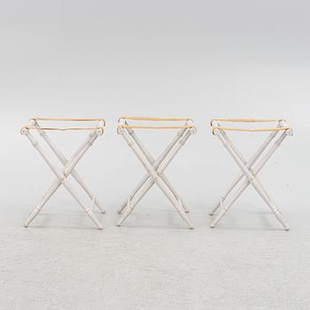 A set of three luggage stands, 20th century.