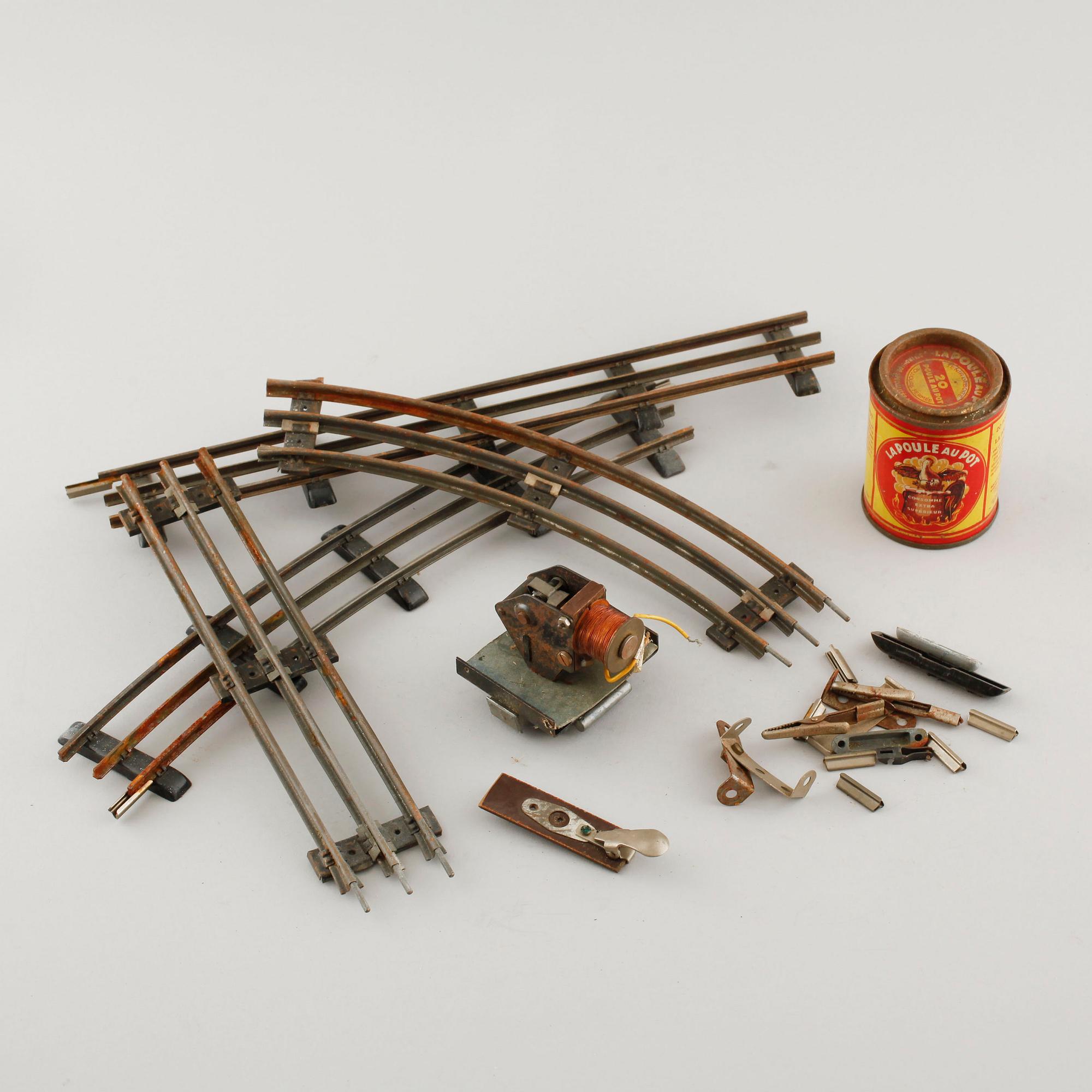 A 1940/50s model train set of 31 pcs in O-scale made by HAG, Switzerland.