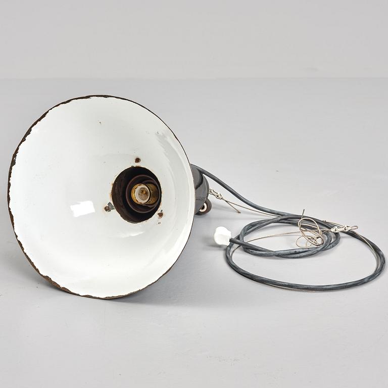 An early 20th century industrial lamp.