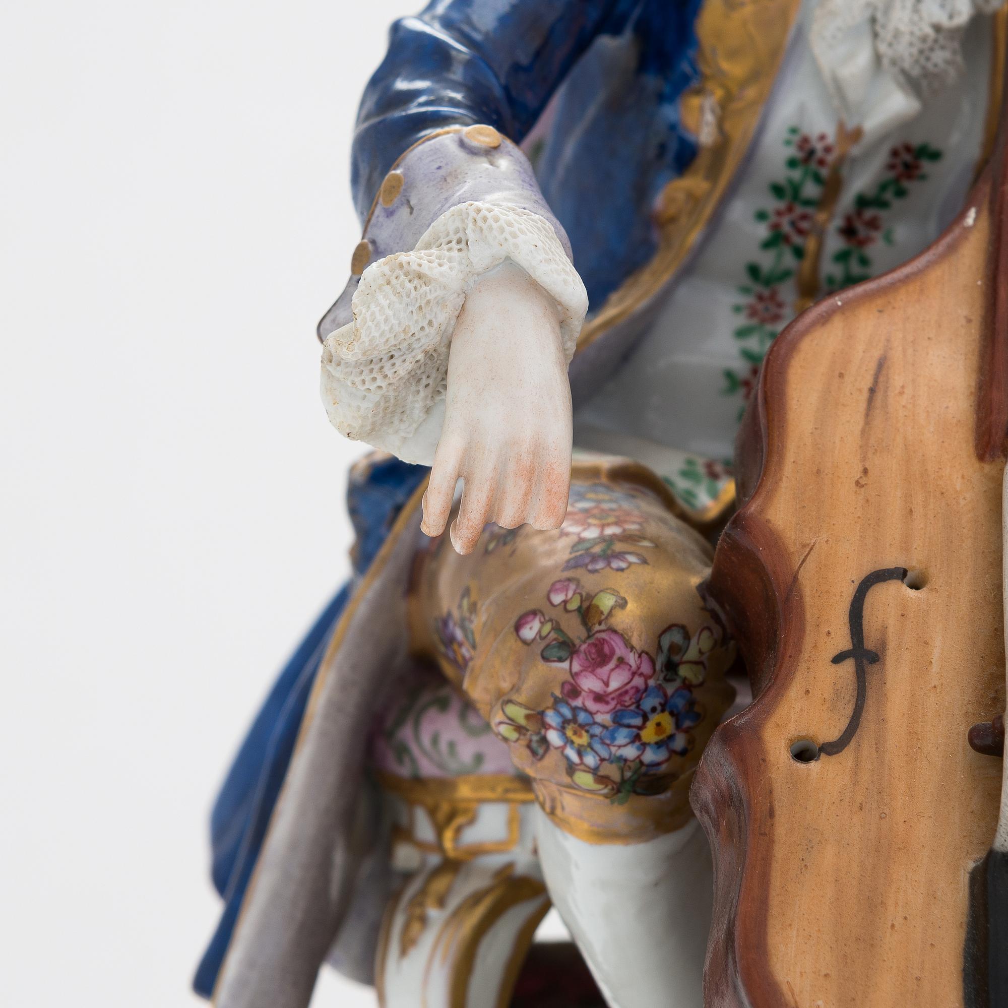 A Volkstedt porcelain musical trio figurine, mid-20th century. Length 40 cm.