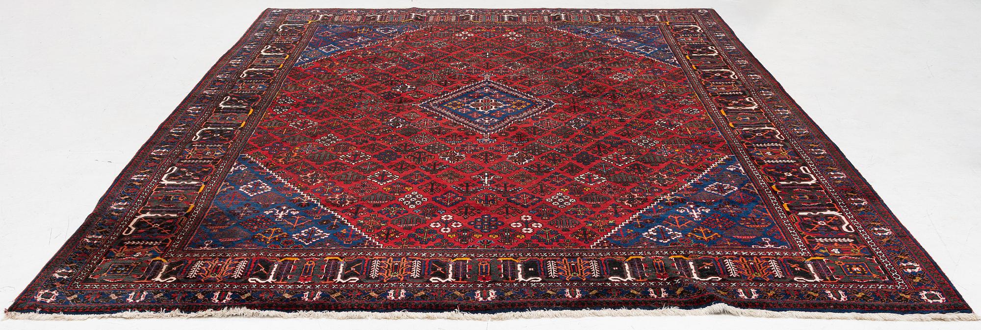 An oriental rug, c. 365 x 285 cm.