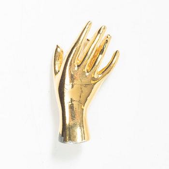 Estrid Ericson, a brooch.