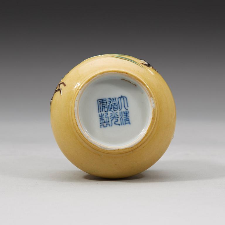 A yellow brush pot, Qing dynasty with Daoguang mark and period (1821-1850).