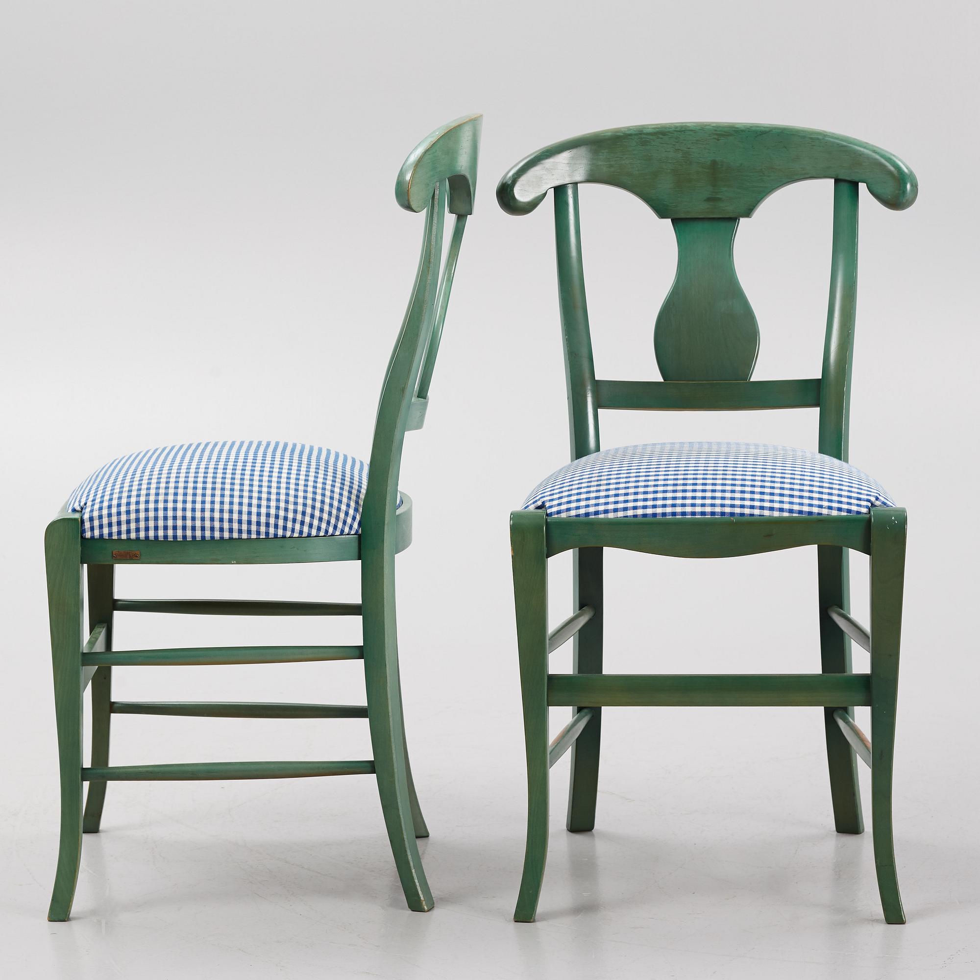 A dining table with eight chairs, Grange, France, late 20th century.