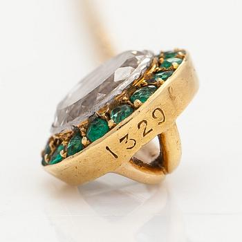 An 18K gold tiepin with a diamond ca 0.91ct and emeralds.