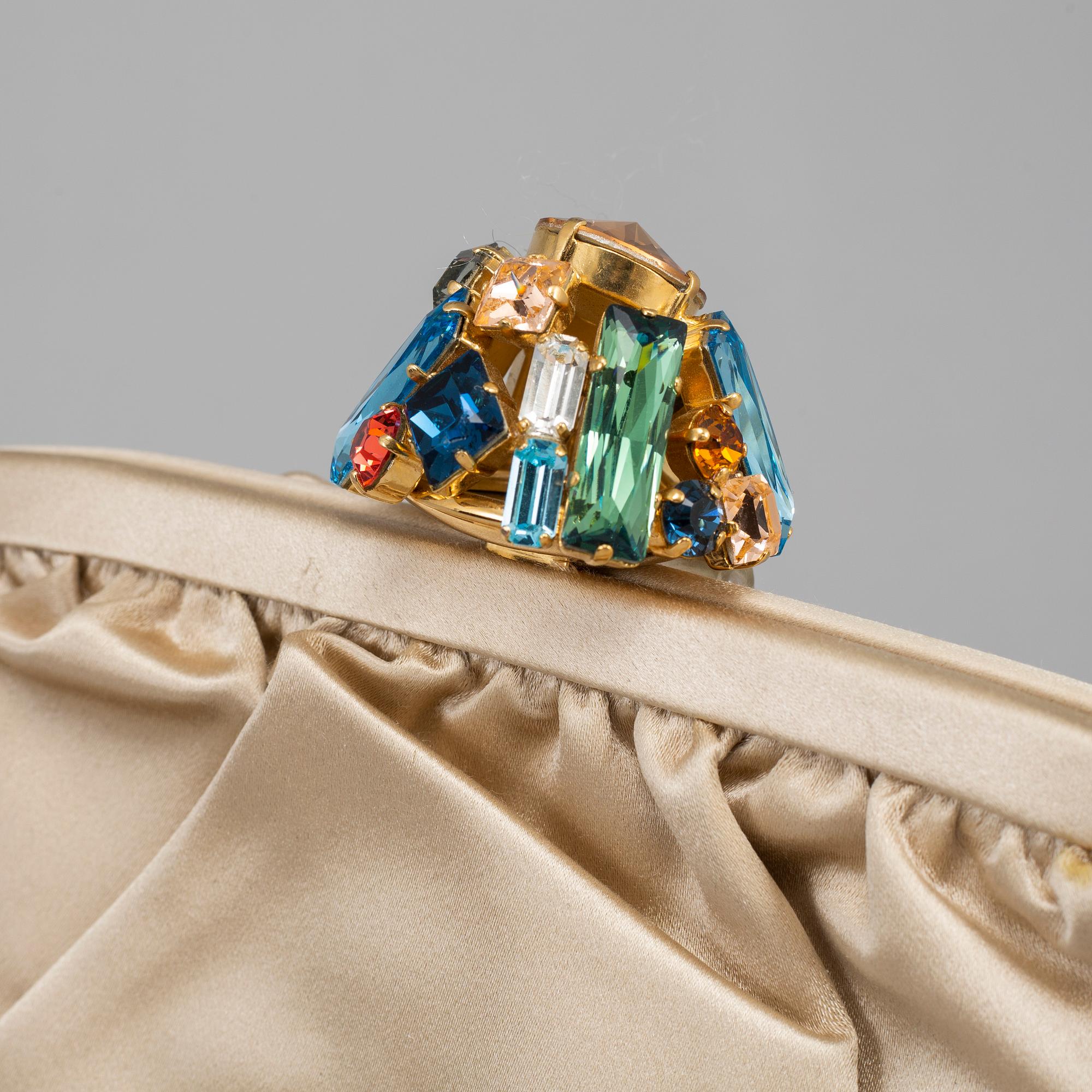 DOLCE & GABBANA, a satin clutch.