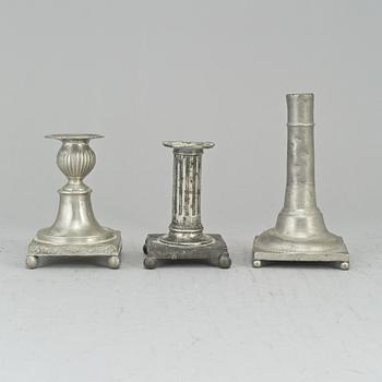 Three 19th century gustavian pewter candlesticks.