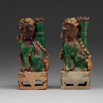 Two green, aubergine and yellow glazed bisquit joss stick holders, Qing dynasty, Kangxi (1662-1722).