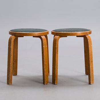 ALVAR AALTO, A PAIR OF STOOLS.
