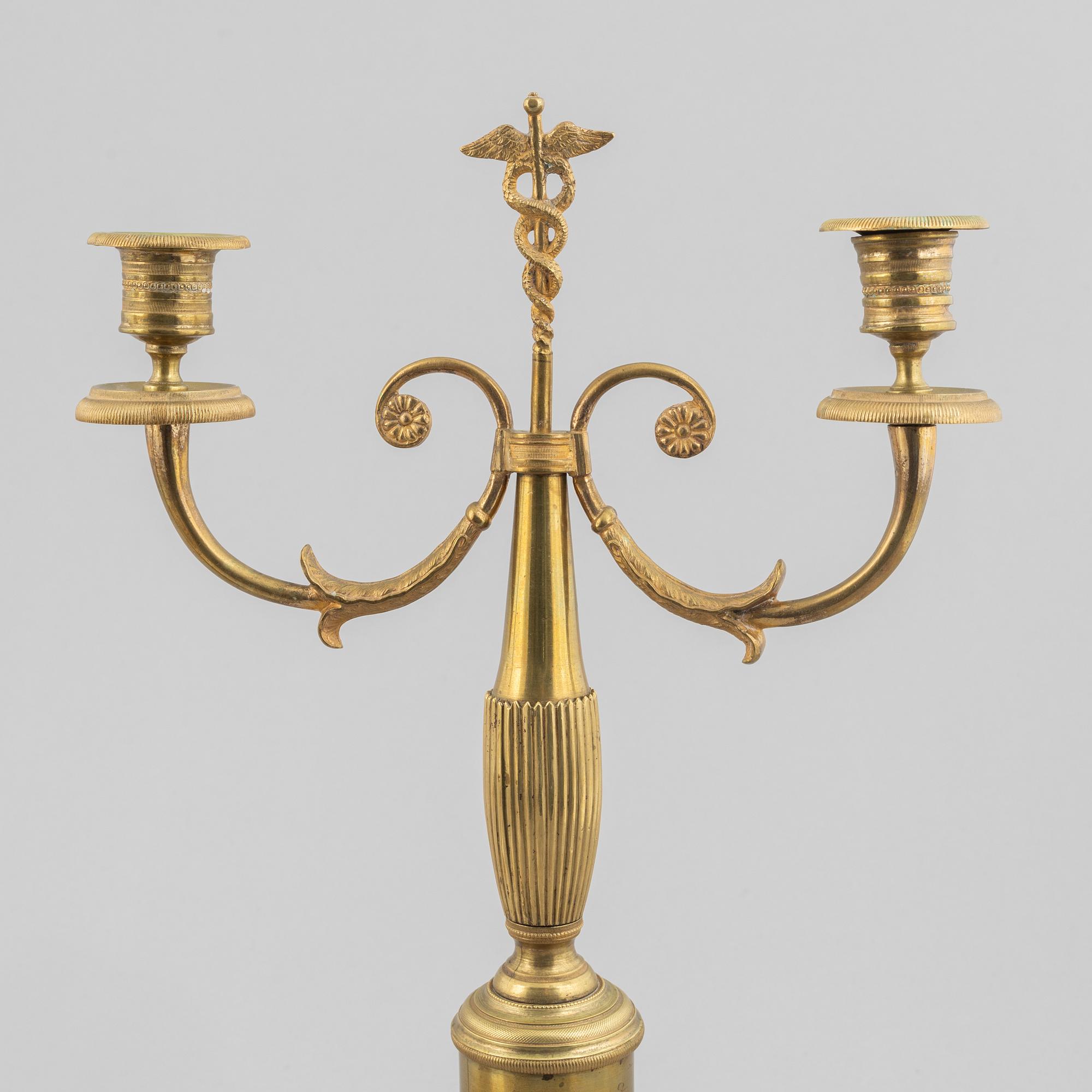 A pair of brass candelabra, first half/mid 19th century.