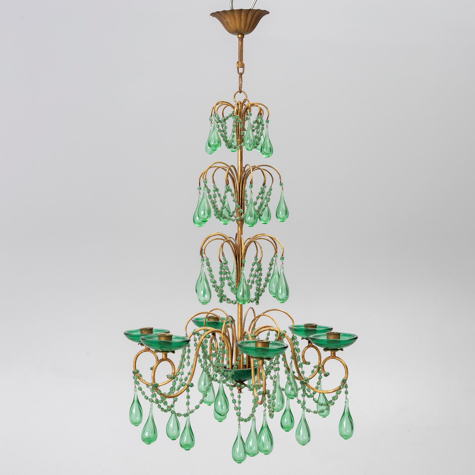 A chandelier, likely from Italy, circa 1950.