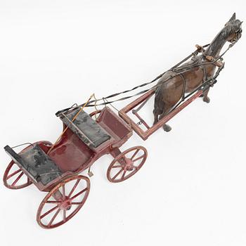 Horse-drawn carriage, early 20th century.