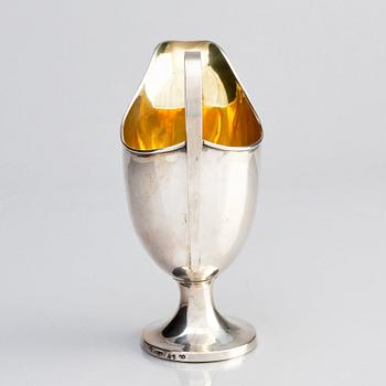 A Swedish parcel-gilt silver cream-jug, mark of Gustaf Hagström, Stockholm 1807.