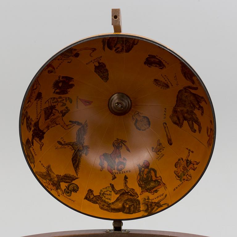 A globe shaped drinks cabinet, circa 2000.