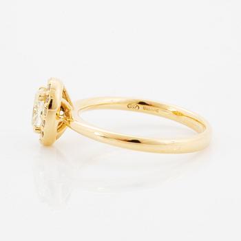 Oval light yellow diamond and brilliant-cut diamond ring.