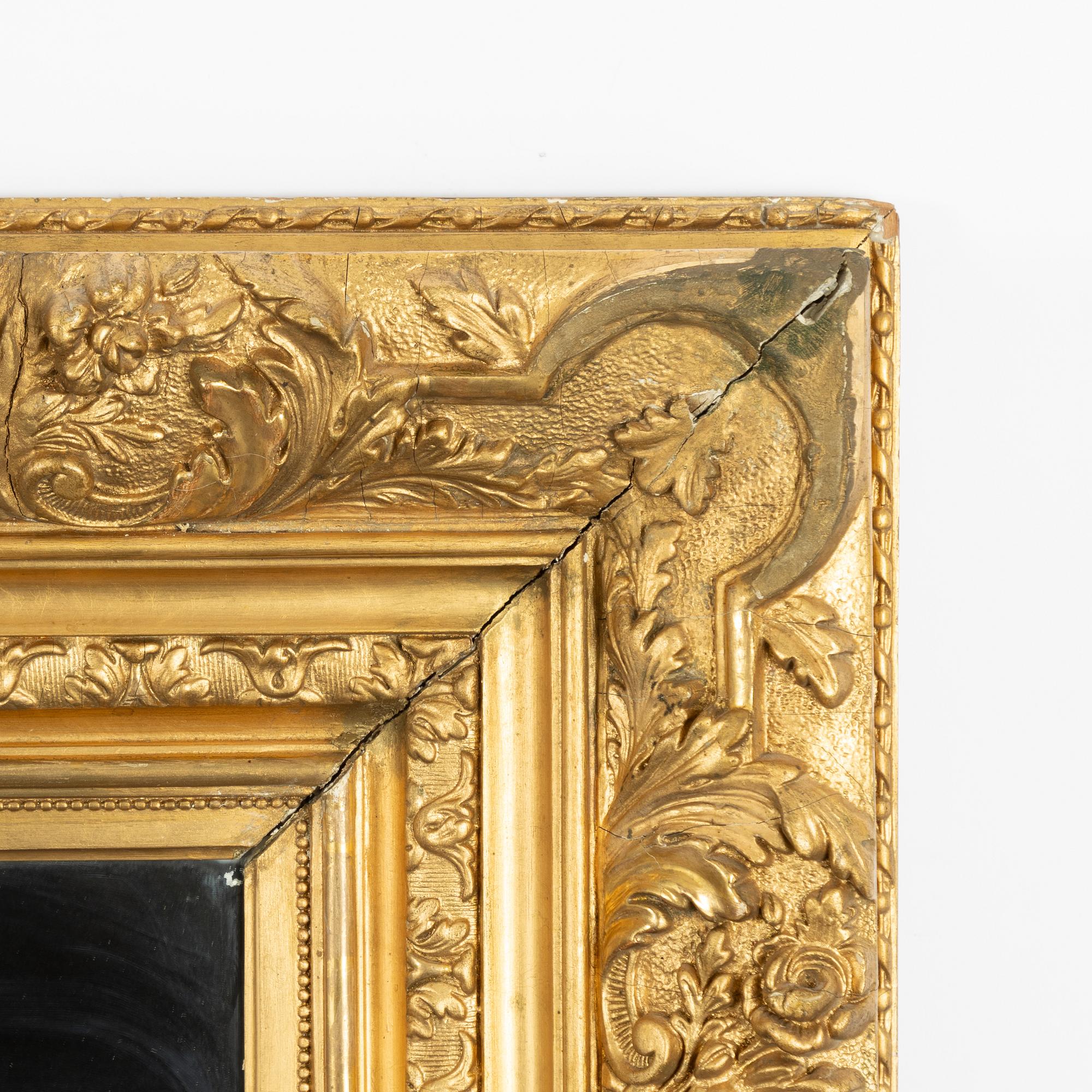A picture frame, early 20th century, converted into a mirror.