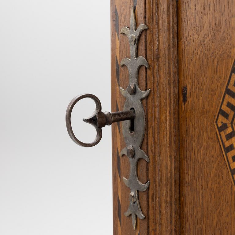 A corner cabinet, late 19th century.