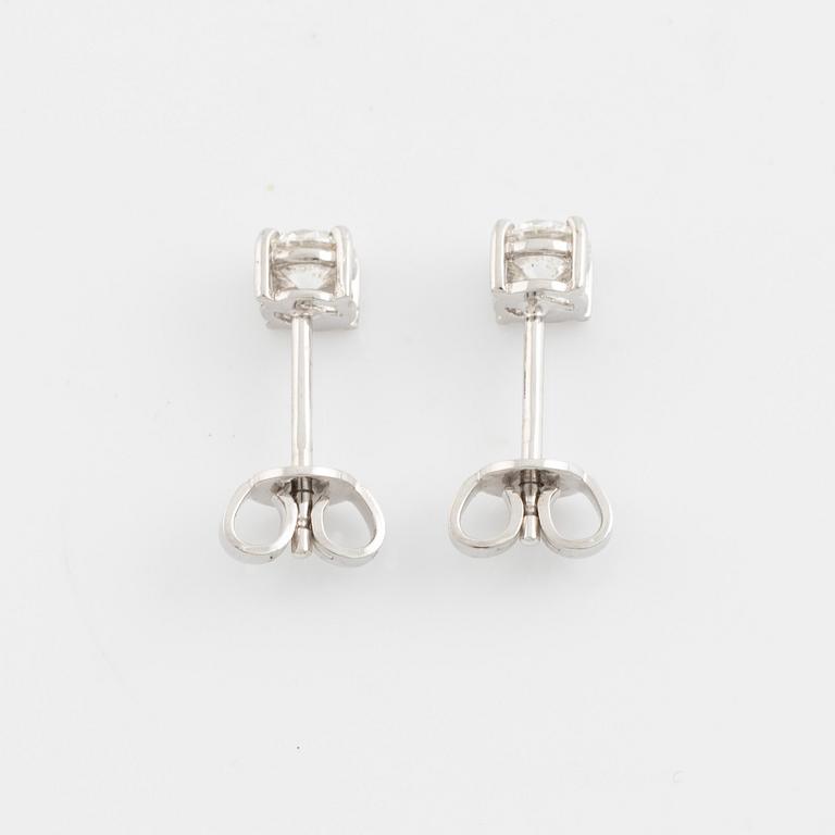 Brilliant cut diamond stud earrings.