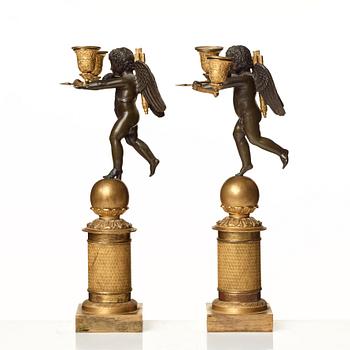 A pair of French Empire two-light candelabra.