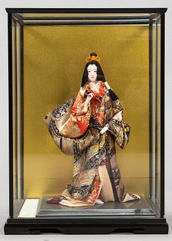 Four late 20th century Japanese dolls.