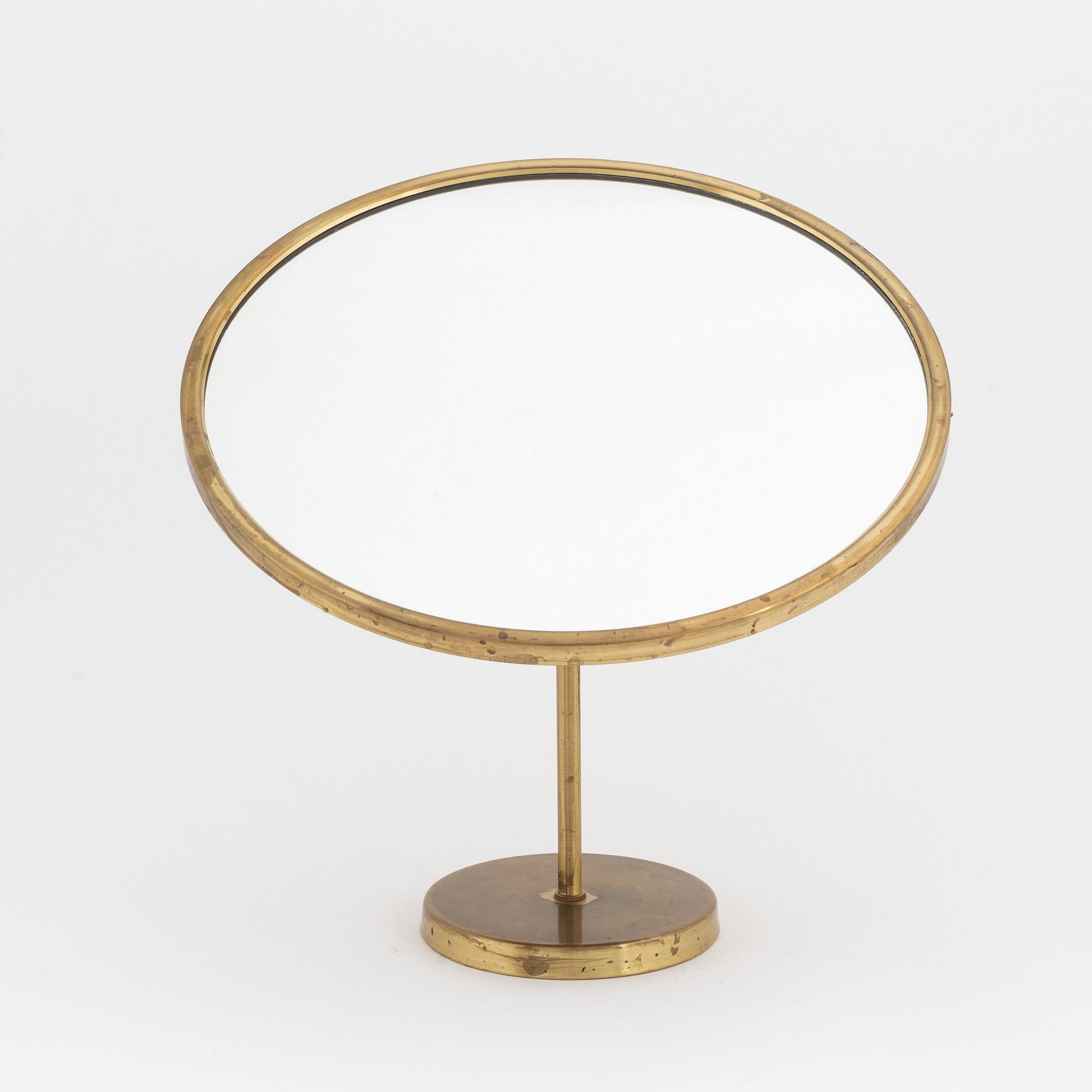 A Swedish Modern brass table mirror, 1940's/50's.