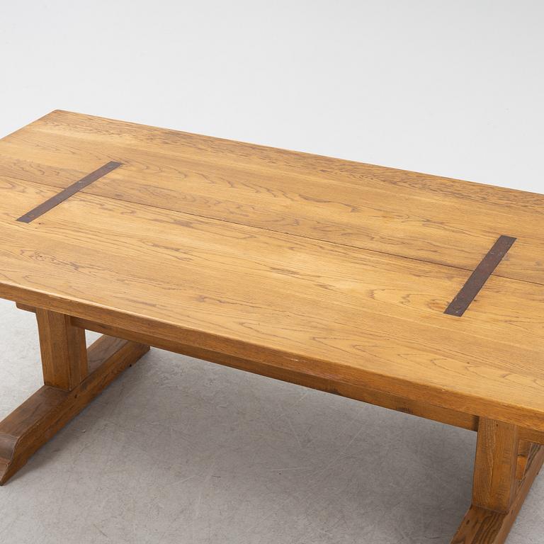An oak trestle table.