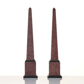 A pair of Egyptian porphyry obelisks 20 th century.