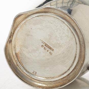 A silver coffee pot, creamer and sugar bowl, import marks of Axel Larson, Helsingborg 1920.