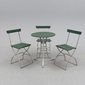 A garden table and four chairs, first half of the 20th century.