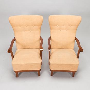 A pair of 1950s armchairs.