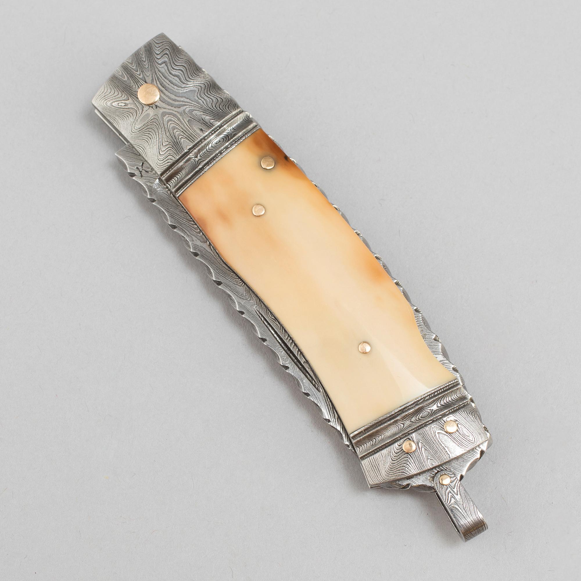 Kaj Embretsen, a damascus steel folding knife, signed.