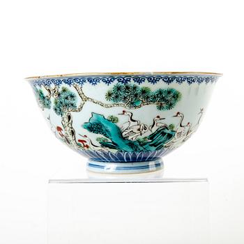 A famille rose bowl, late Qing dynasty, with Qianlong mark.