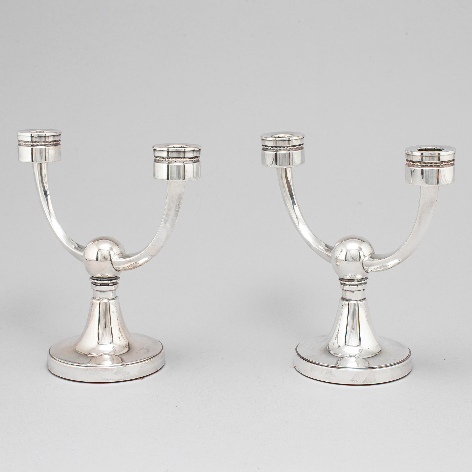 A pair of silver candelabra from MGAB, Uppsala, 1969-71.