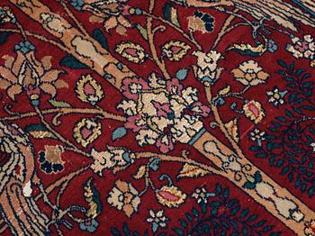 A rug, a semi-antique Esfahan figural part silk, ca 222-227,5 x 128-135,5 cm.